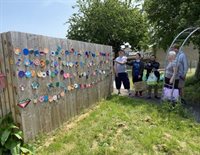 Crawshay Garden picture with a wall of colourful designs