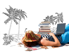 Lady relaxing on beach with laptop