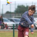 Child throwing foam rocket