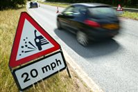 Car driving past a 20mph sign